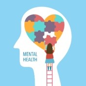 girl putting together puzzles pieces inside person's head in shape of heart