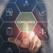 person pressing word that reads compliance with other associated icons