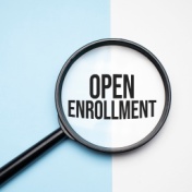 magnifying glass that says open enrollment